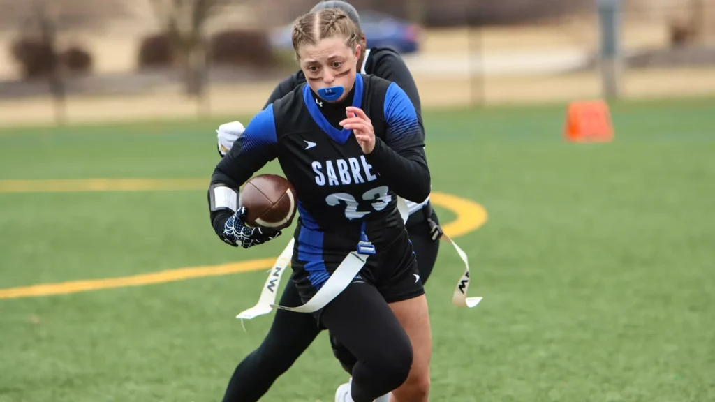 women playing college flag football