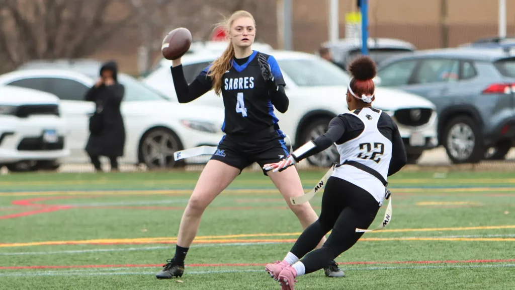 Women playing college flag football