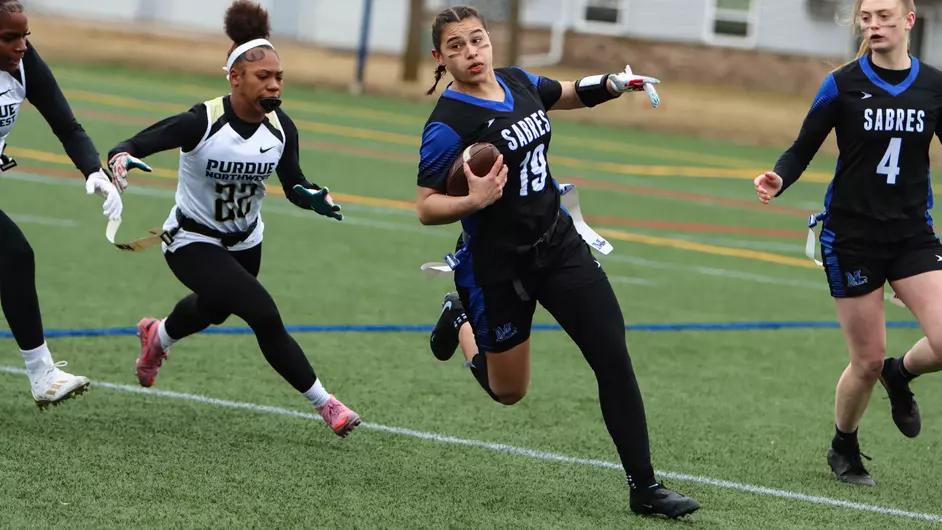 Women playing college flag football