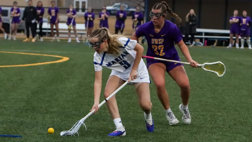 women playing college lacrosse