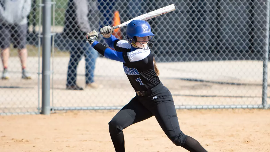 Women playing college softball