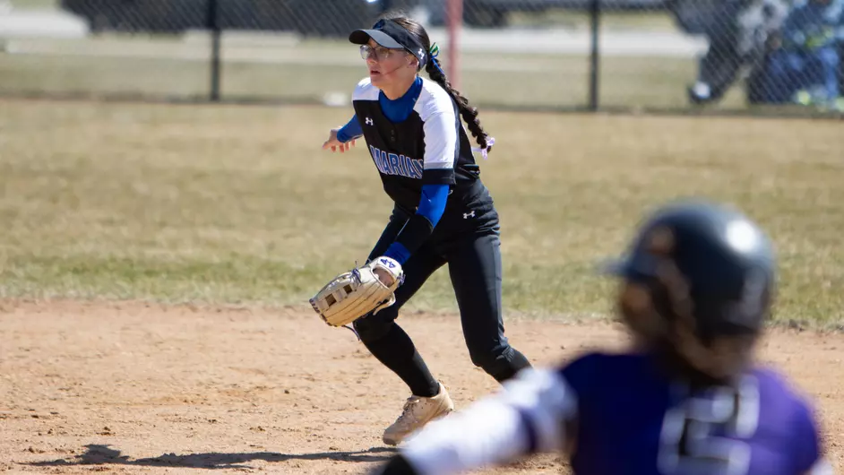 Women playing college softball