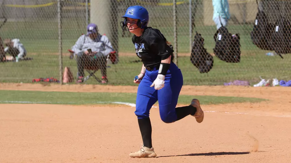 women playing college softball