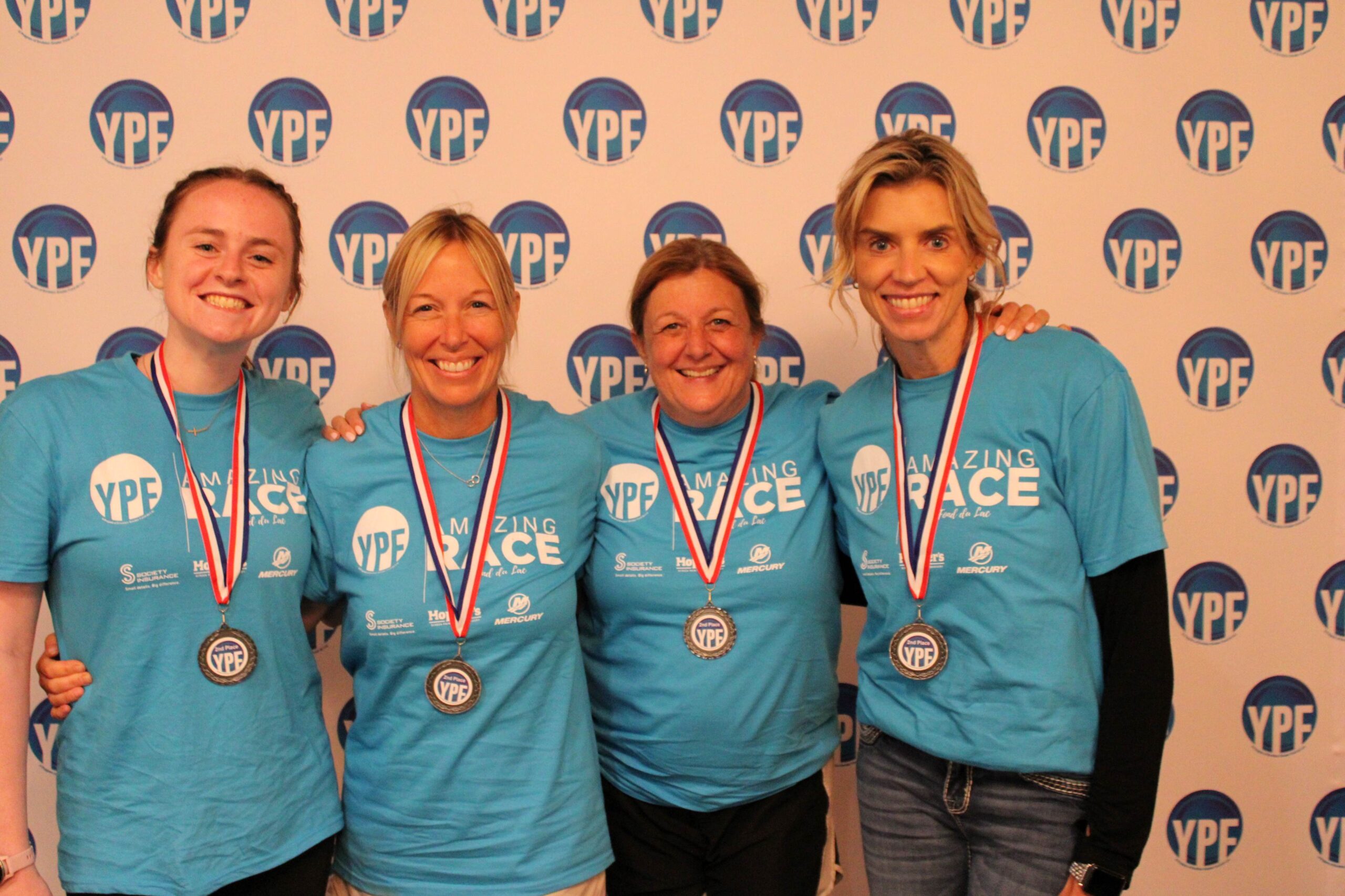 Four women with medals