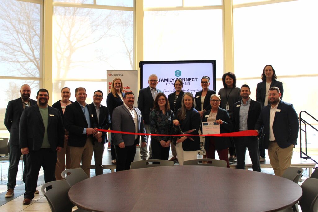 A large group inside for a ribbon cutting