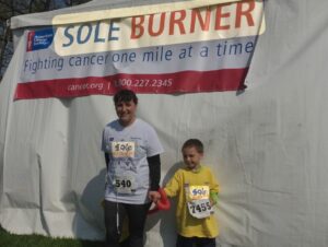A woman and a child at a race finish line