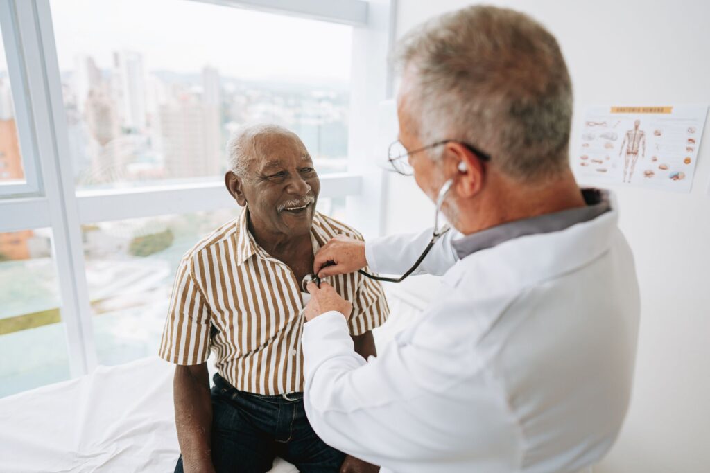 An older man as a patient with a doctor