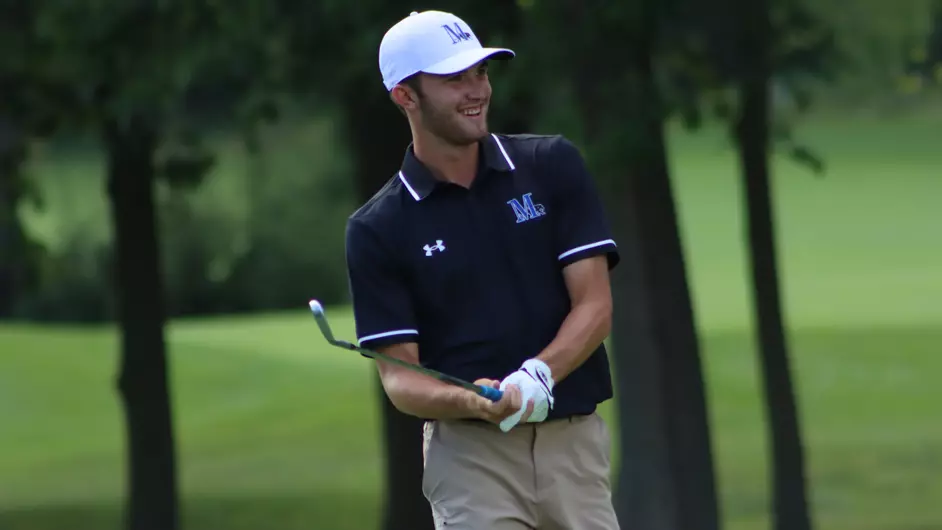 A man playing golf for his college