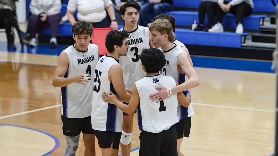 Men playing college volleyball