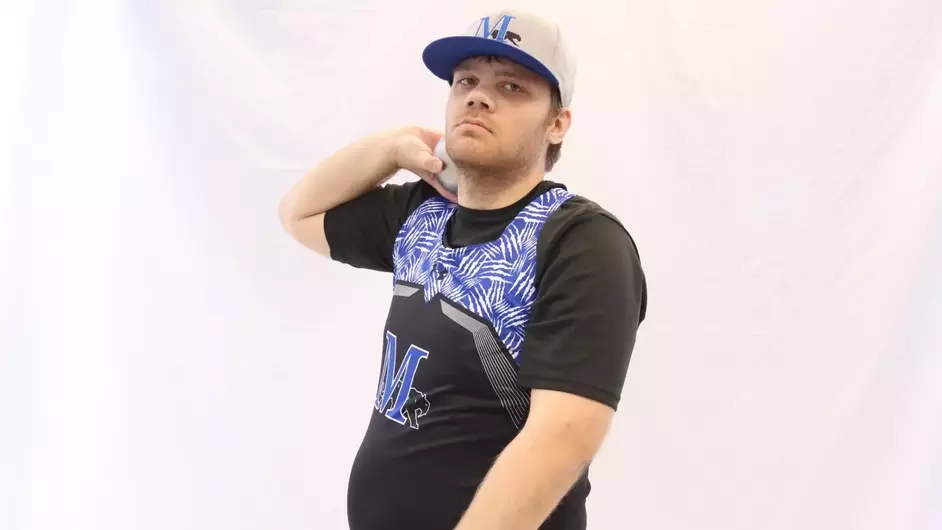 A man holding a shot put