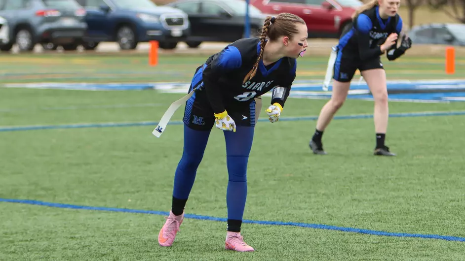Women playing college flag football