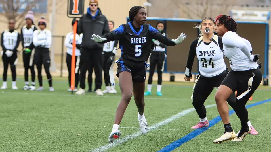 Women playing college flag football