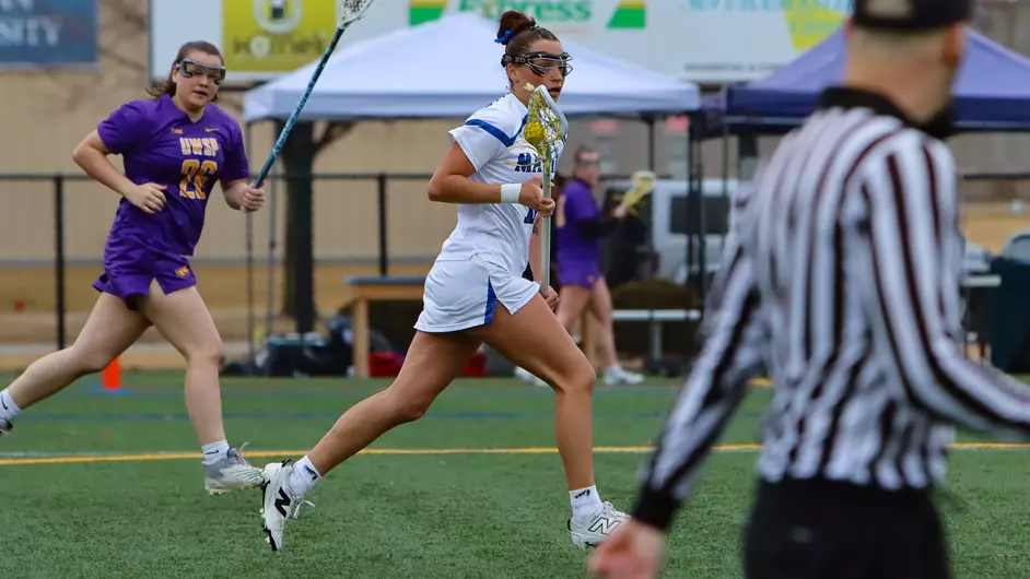women playing college lacrosse