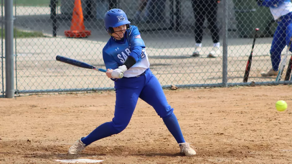 Women playing college softball