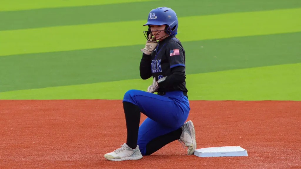 Women playing college softball