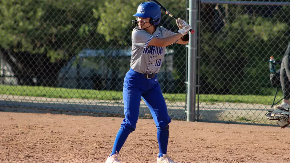 Women playing college softball