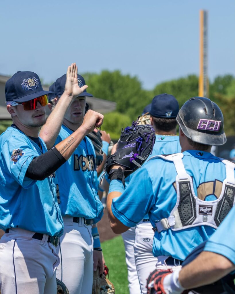 A group of baseball players high-fiving
