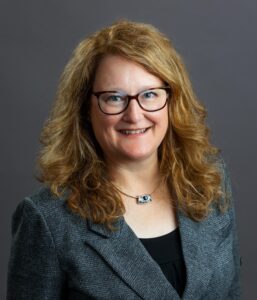 A smiling middle aged woman