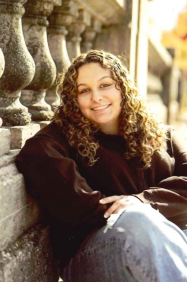 A smiling young woman sitting