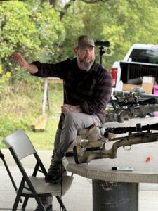 A man sitting on a table outside