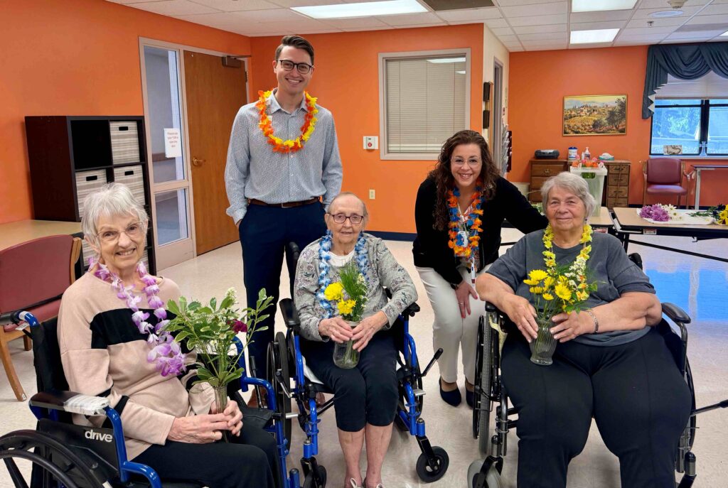 Five people with three in wheelchairs