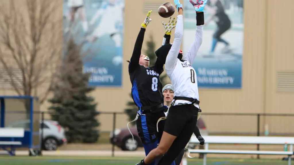 Women playing college flag football