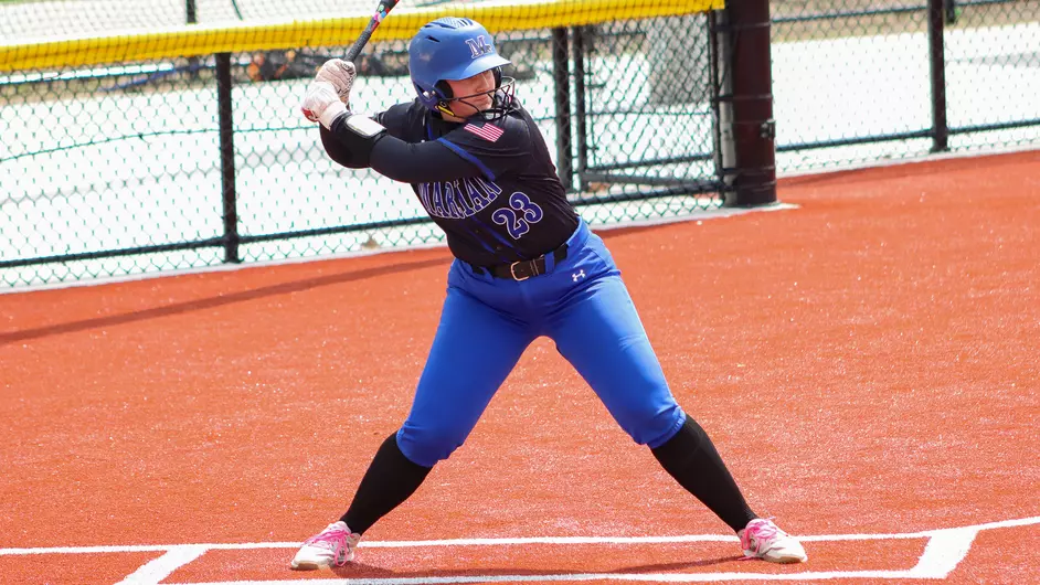 Women playing college softball