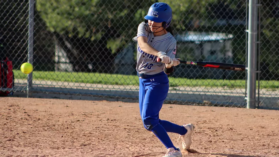 Women playing college softball
