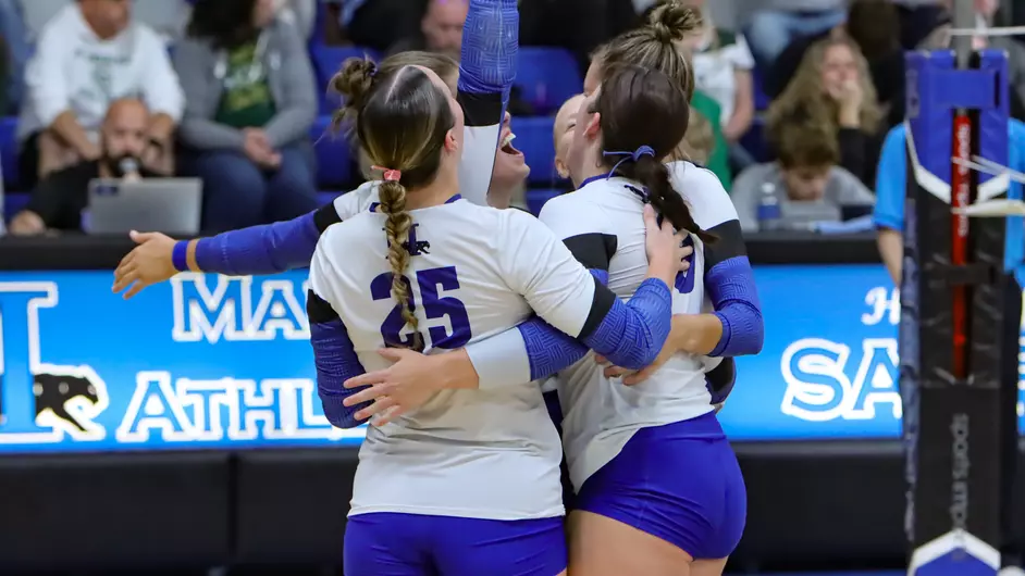 A group of female college volleyball players