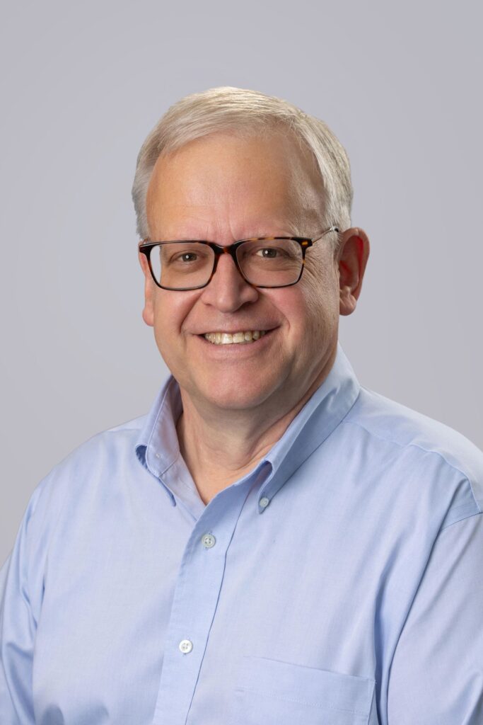 An older smiling man