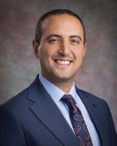 A male doctor in a suit and tie