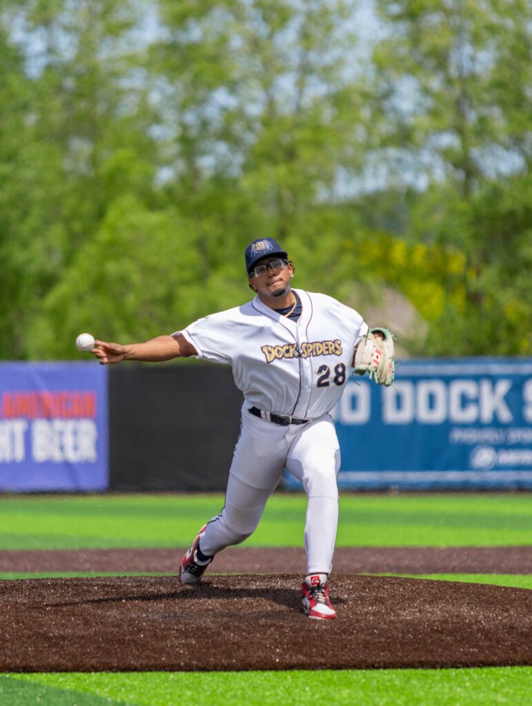Baseball pitcher throwing from the mound