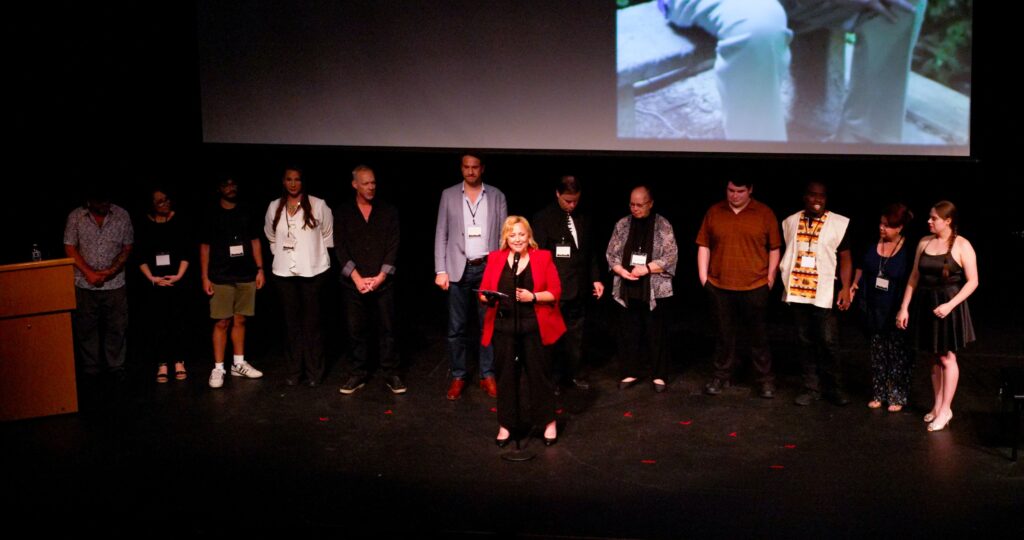 A large group on stage