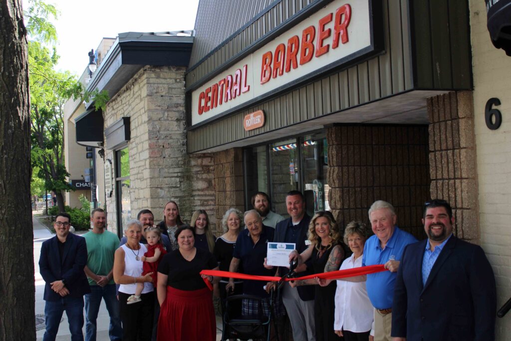 A large group outside for a ribbon cutting