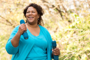 A woman walking with weights