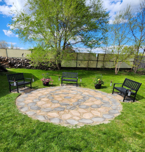 An outside patio with benches