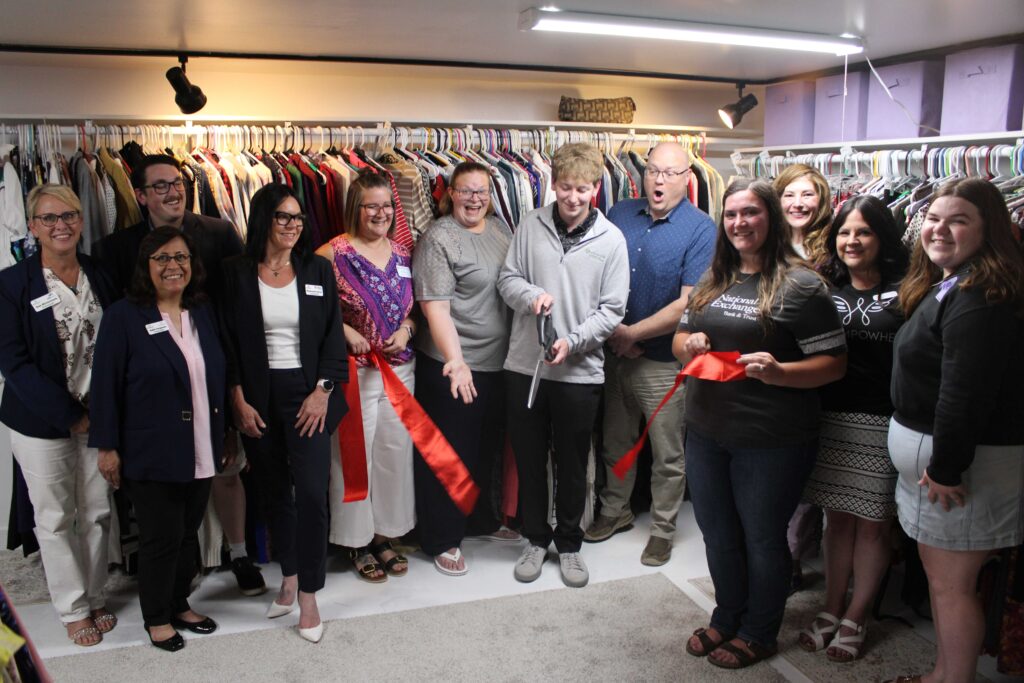 A large group inside for a ribbon cutting
