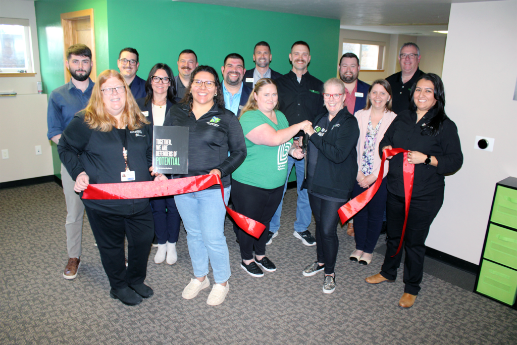 A large group inside for a ribbon cutting