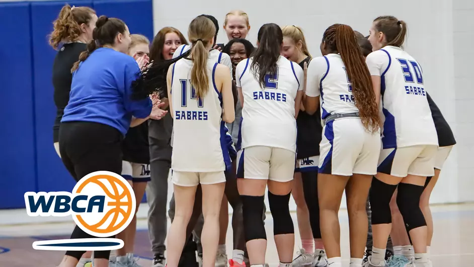 Women playing college basketball
