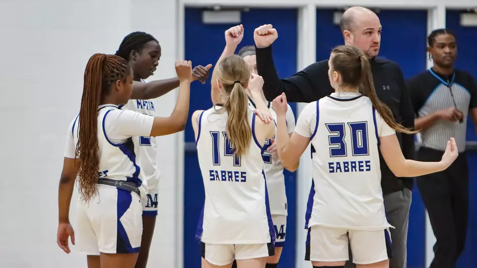 Women playing college basketball