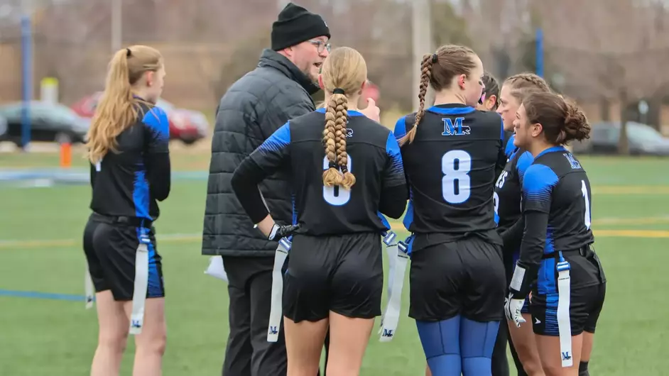 Women playing college flag football