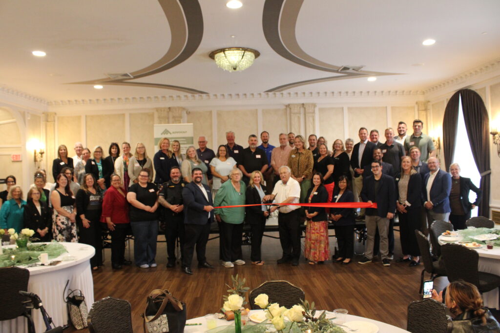 Large group inside for a ribbon cutting