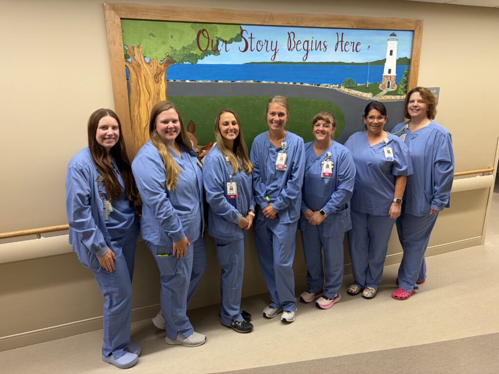 A line of eight nurses at a hospital