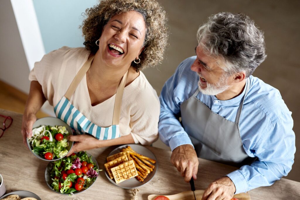 Two older women eating