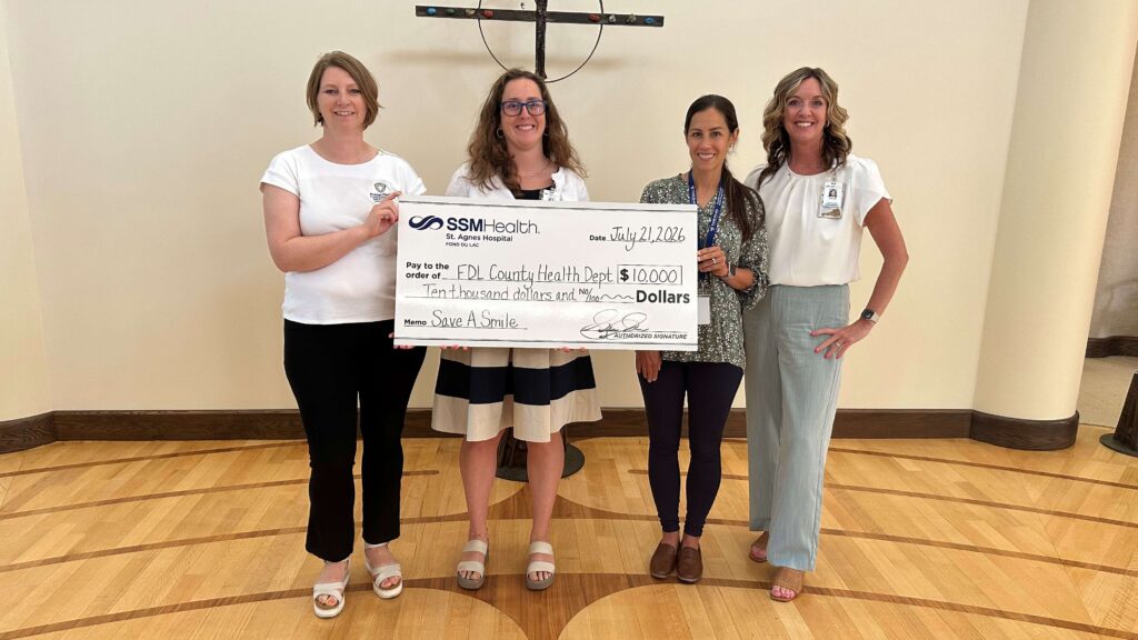 Four women and a big check