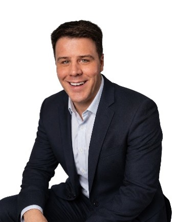 A smiling man in a suit