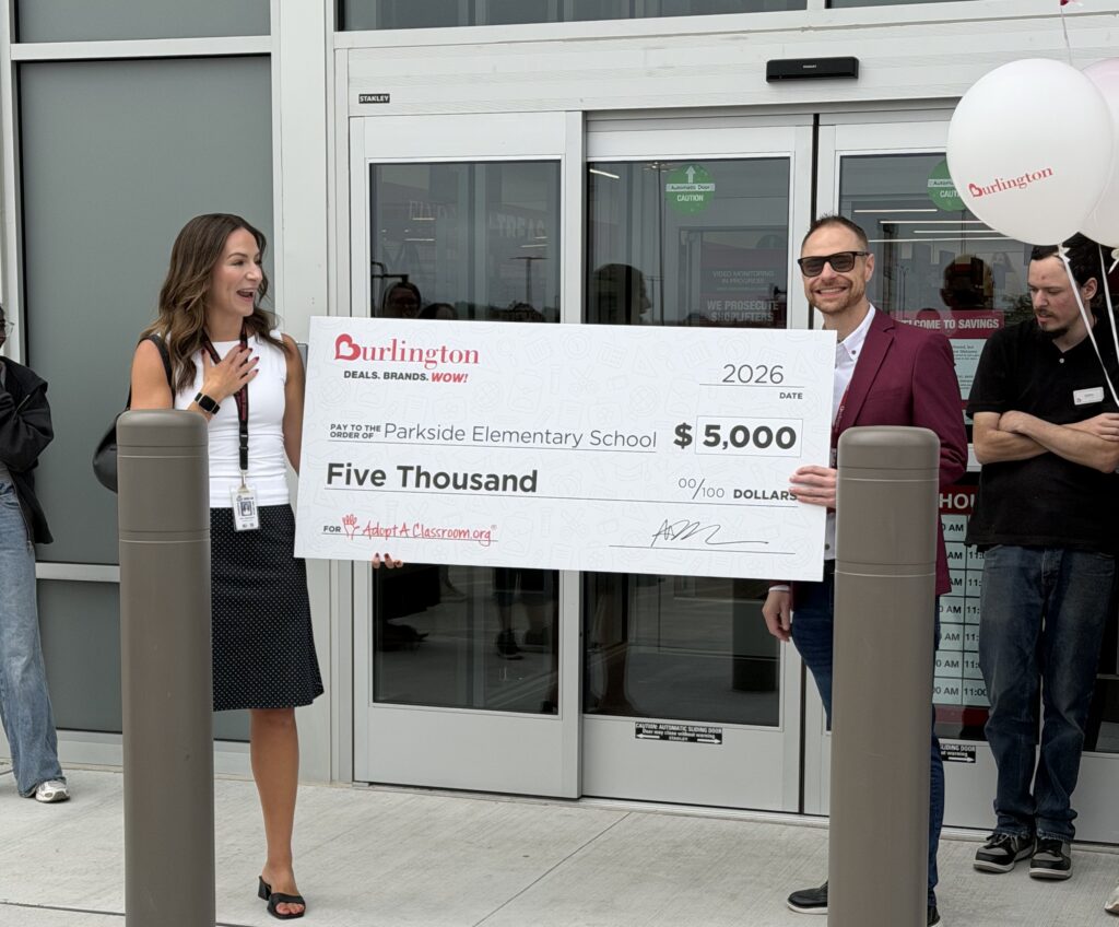 A man and a woman and a big check