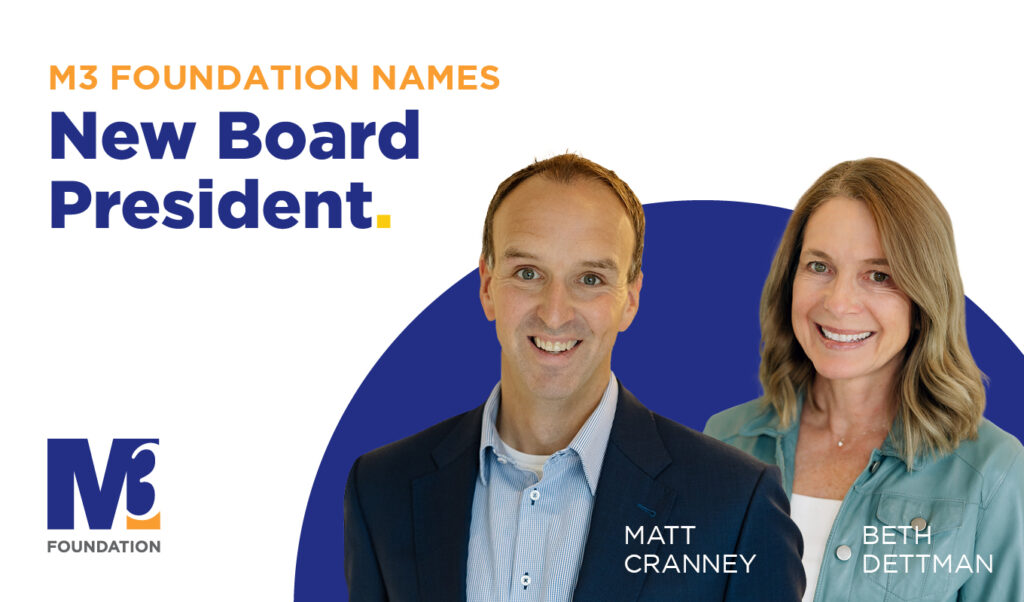 A man and a woman announcing a board president