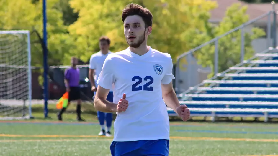 Men playing college soccer