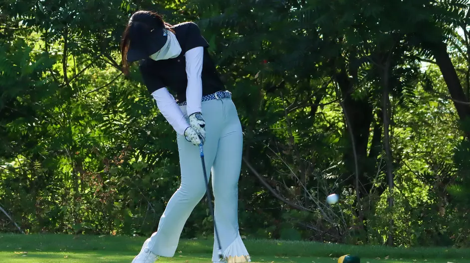 women playing college golf